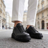 Men's casual black sneakers with lace-up front and chunky tread sole