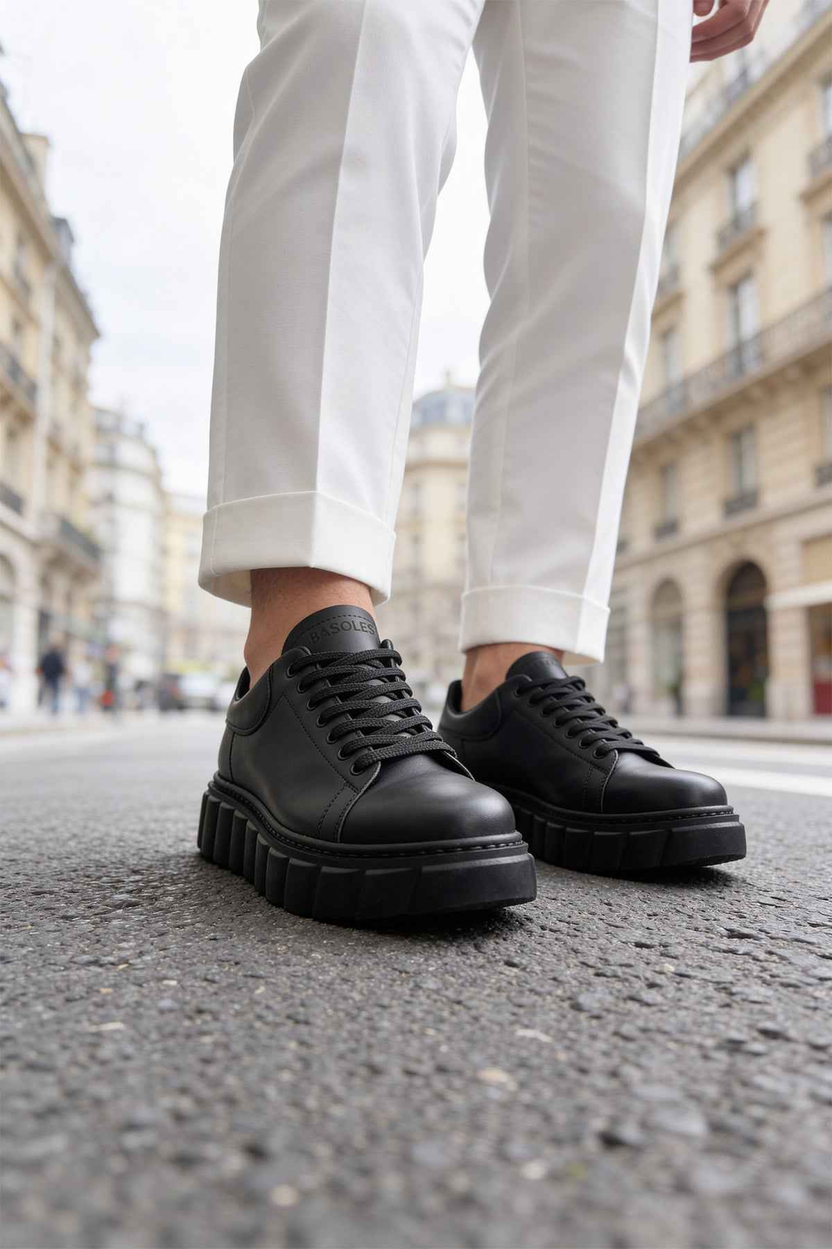 Men's casual black sneakers with lace-up front and chunky tread sole