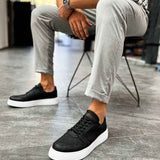Men's black lace-up sneakers with white rubber sole, side view
