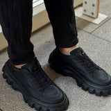 Men's casual black lace-up sneakers with chunky lug sole