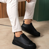 Black casual slip-on sneakers, low profile, side panel stitching