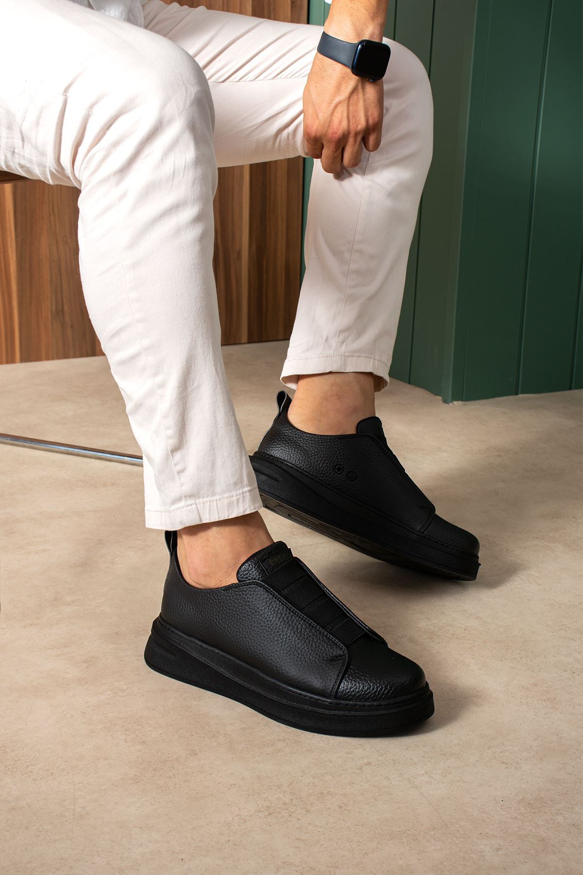 Black casual slip-on sneakers, low profile, side panel stitching