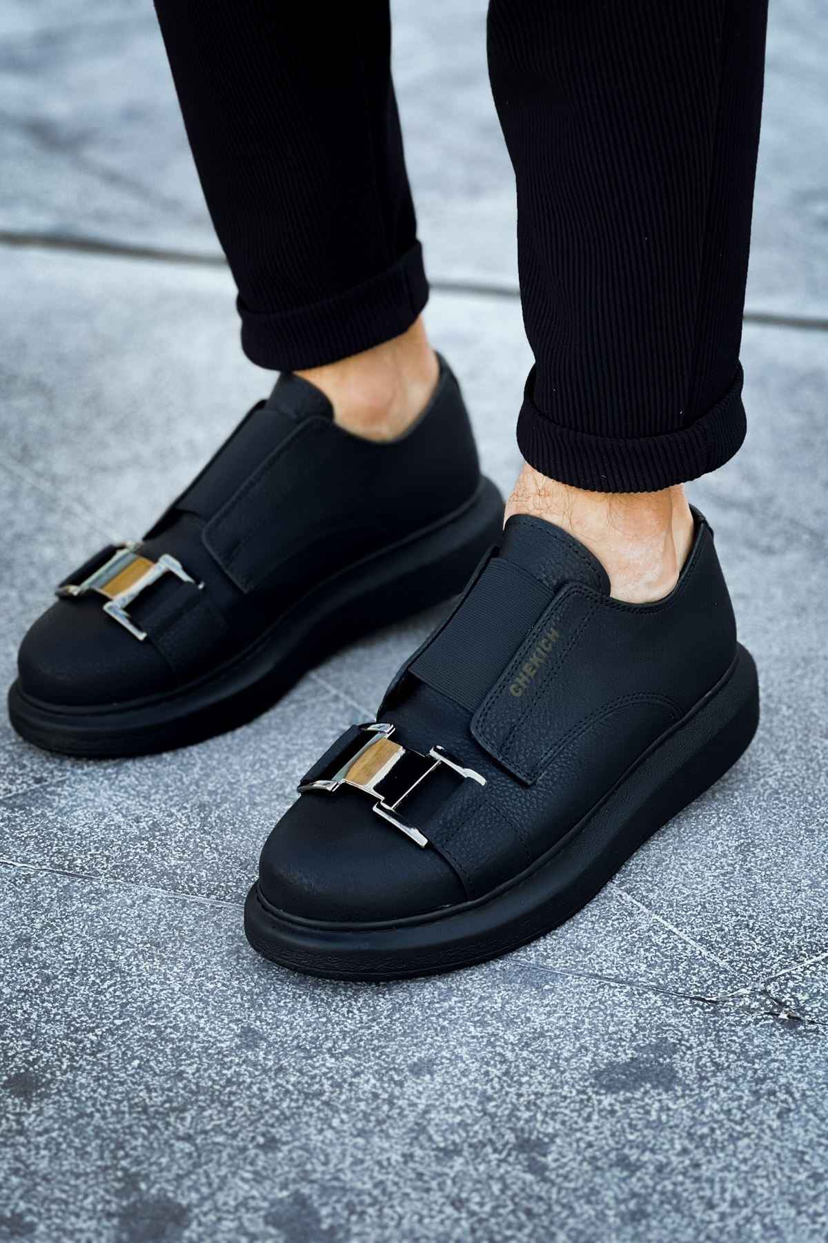 Black casual sneakers with two buckle straps on vamp and chunky rubber sole