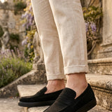 Men's black suede loafer with slip-on design and textured sole edge