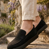 Men's black suede loafer with low platform sole and moc-style detailing