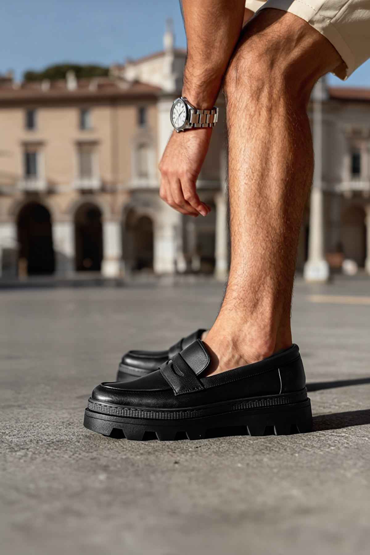 Men's black loafer with strap detail and treaded sole