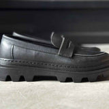 Men's black loafer upper with strap tab and textured rubber sole