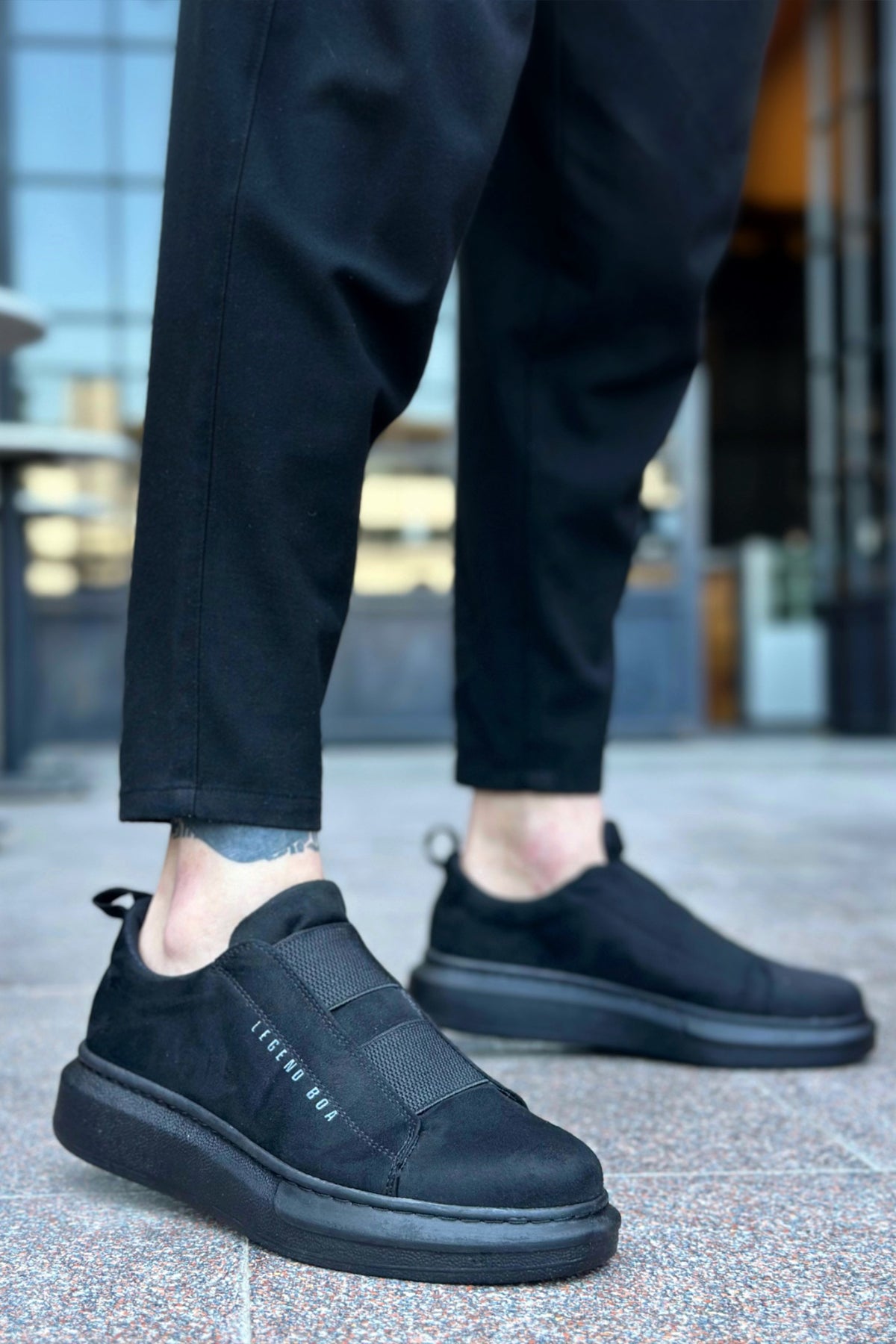 Men's black suede casual sneakers with lace-less slip-on design and side stitching