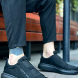 Men's black suede slip-on sneakers, low profile with textured side panel
