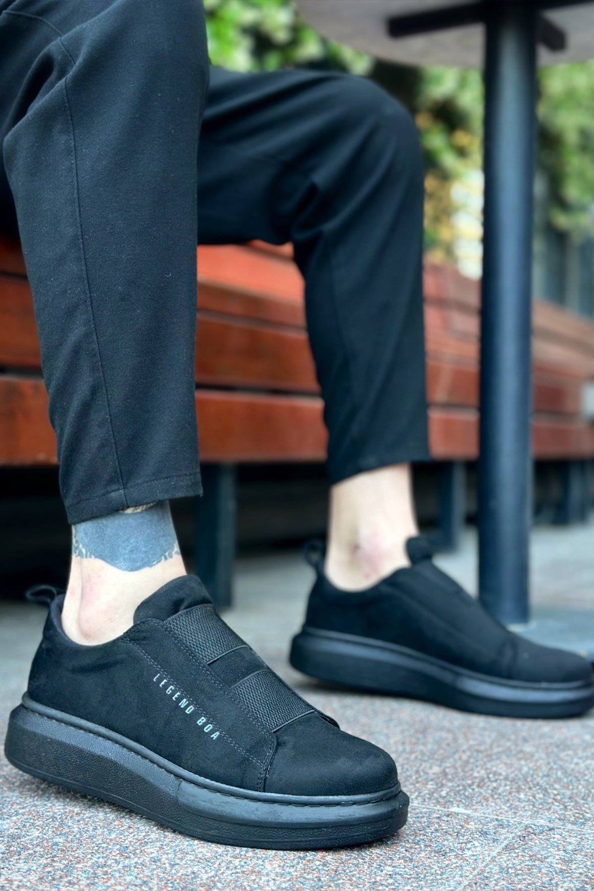 Men's black suede slip-on sneakers, low profile with textured side panel