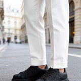 Men's black suede sneakers, lace-up, low-top style with treaded rubber sole