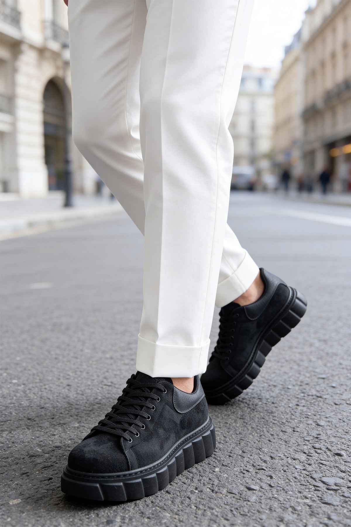 Men's black suede sneakers, lace-up, side profile with textured rubber sole