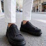 Men's black suede sneakers, lace-up, front/side view with platform sole