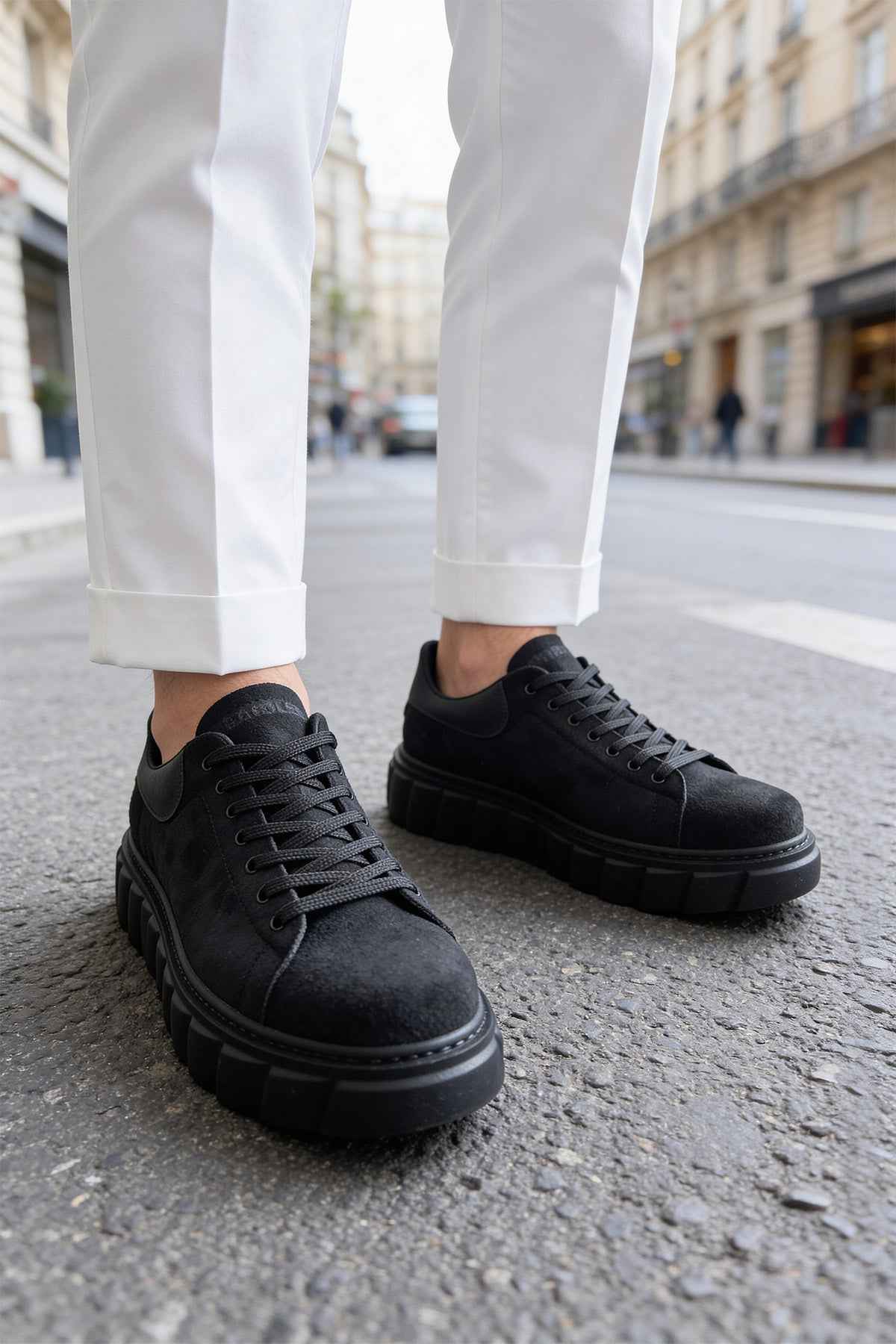 Men's black suede sneakers, lace-up, front/side view with platform sole