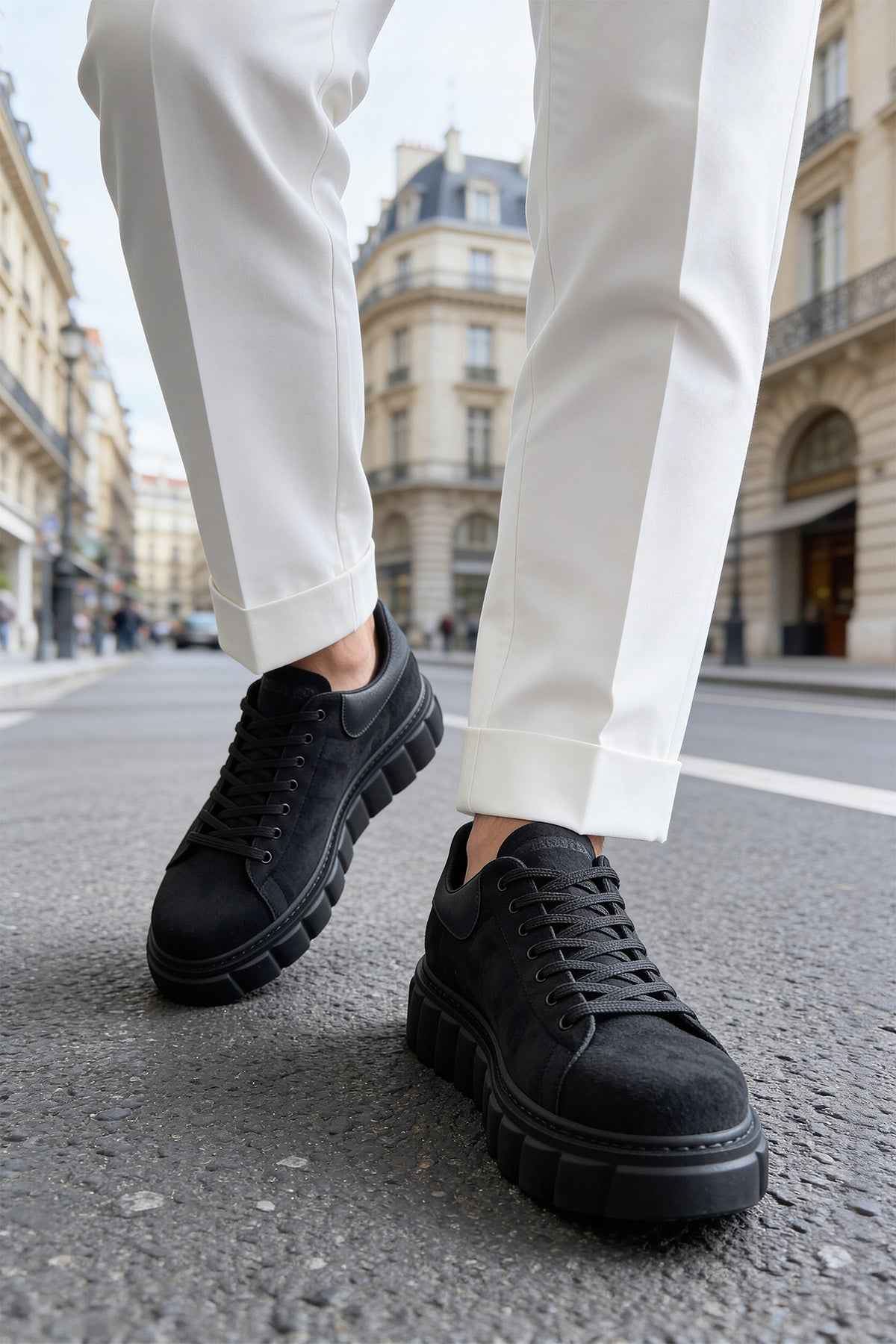 Men's black suede sneakers, lace-up, angled side view with chunky sole