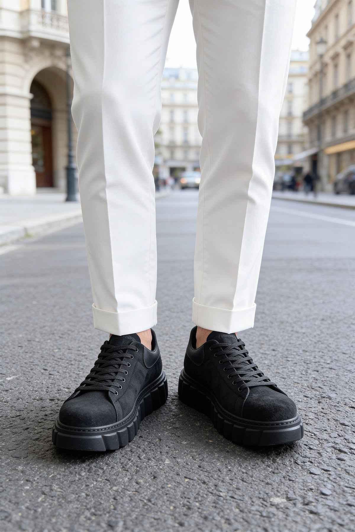 Men's black suede sneakers, lace-up, pair shown from front view with thick sole