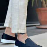 Men's casual black slip-on loafers with white soles