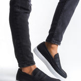 Men's black slip-on loafers with white rubber sole and smooth vamp
