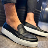 Men's black loafers with white contrast sole and stitched apron detail