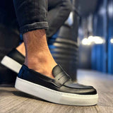 Men's black slip-on loafers with white sole and side seam detail