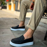 Men's black slip-on loafers with dark upper and white rubber sole