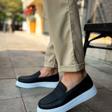 Men's black loafer slip-ons with white sidewall sole and low profile