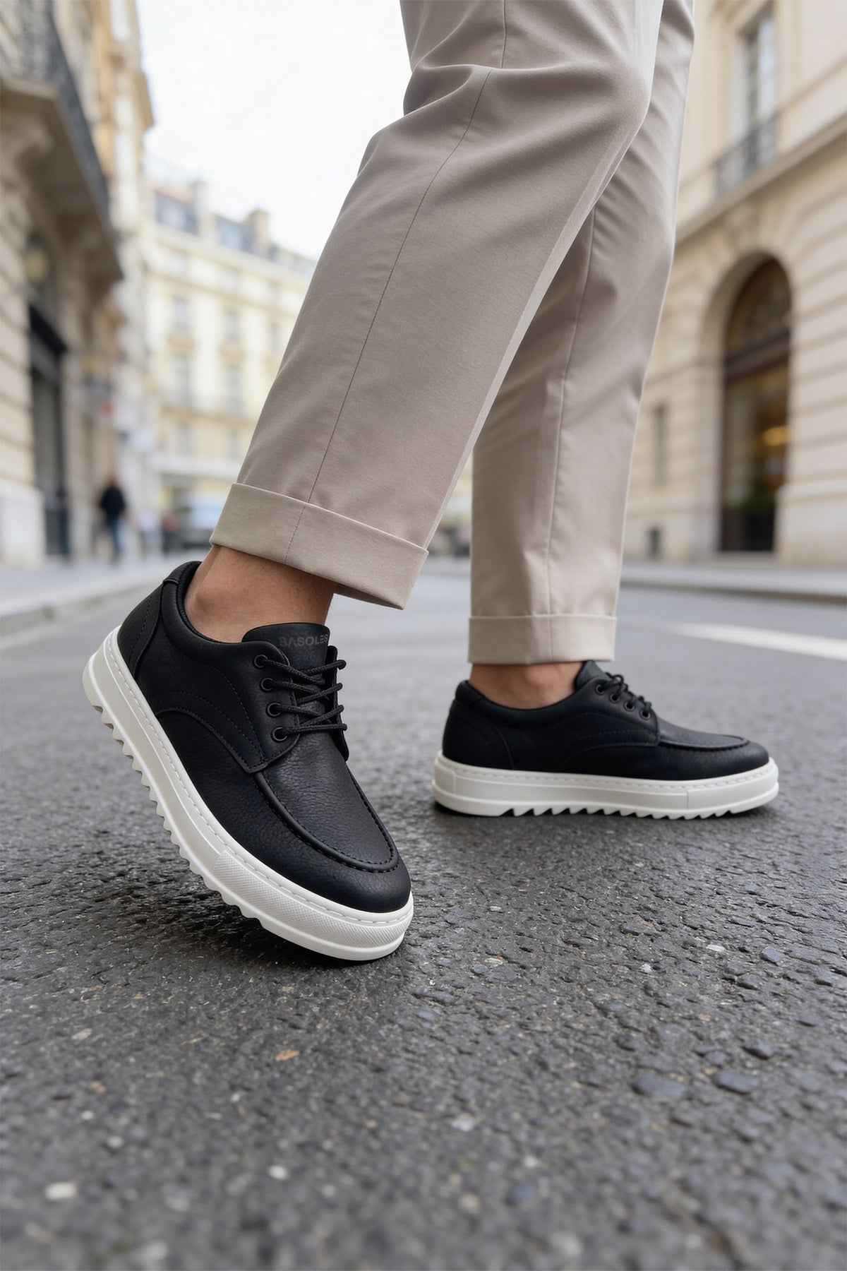 Men's black casual lace-up shoes with white sole, toe and side view
