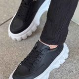Black lace-up sneakers with thick white platform sole