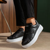 Black lace-up sneakers, white sole and heel tab detail