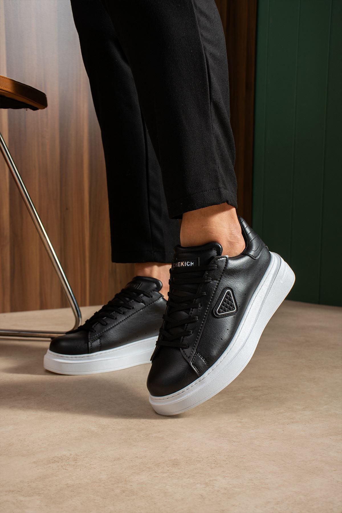 Black lace-up sneakers, white sole and heel tab detail