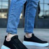 Men's black suede slip-on sneakers with white sole, rounded toe, low profile