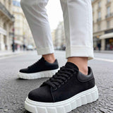 Black suede casual sneakers with lace-up front and white chunky platform sole