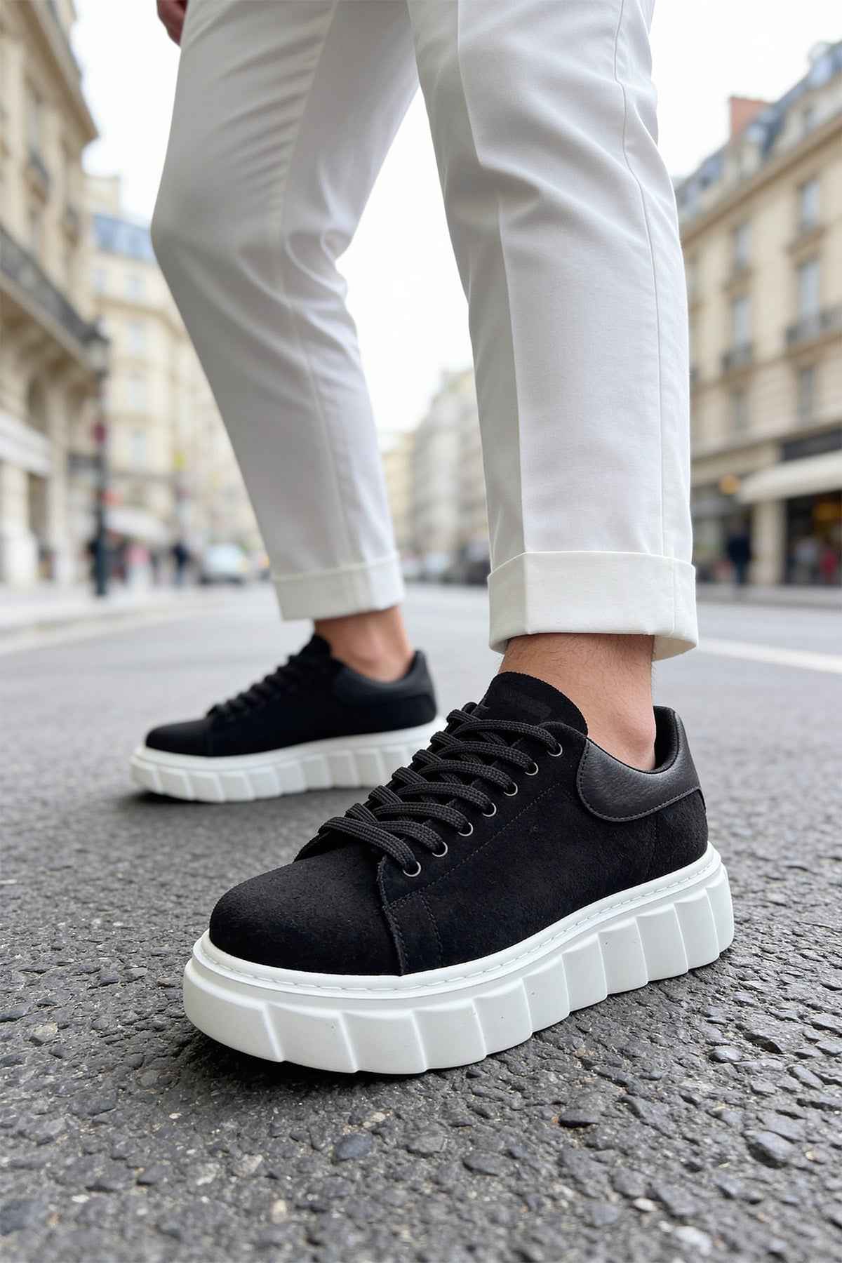 Black suede casual sneakers with lace-up front and white chunky platform sole