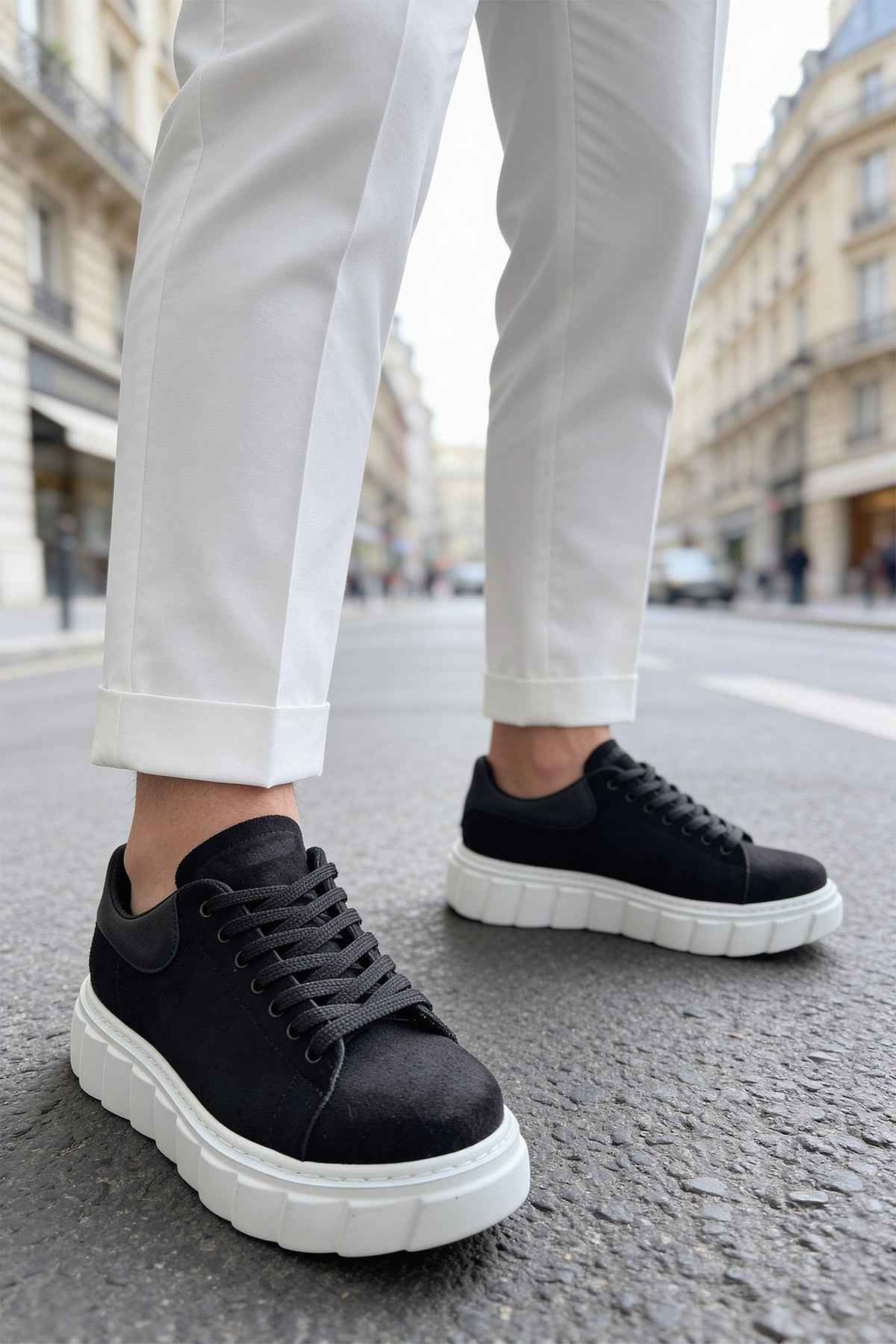 Black suede sneakers with lace-up vamp and white thick sole