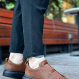 Men's brown sneakers with dark rubber sole and side strap detail