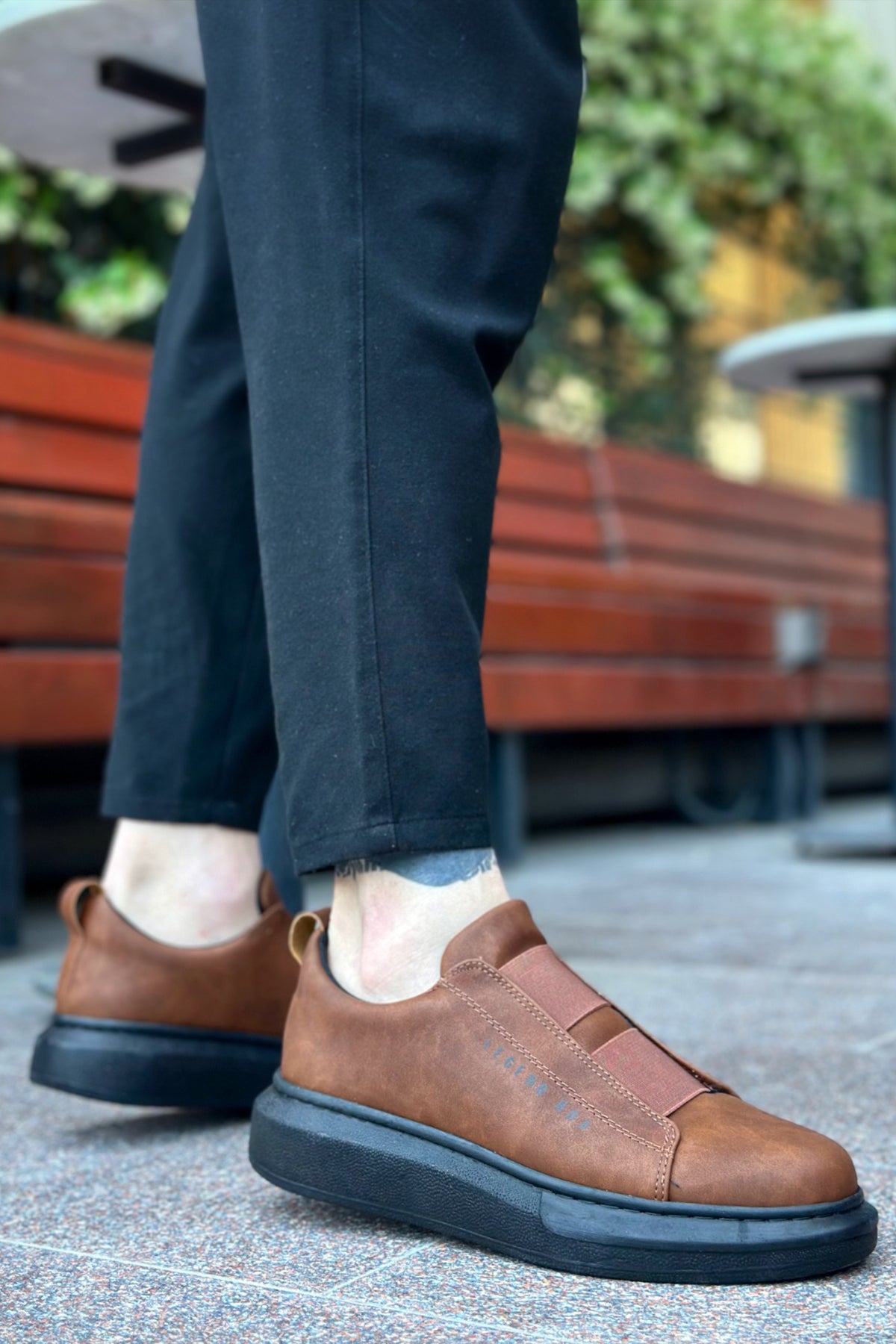 Men's brown sneakers with dark rubber sole and side strap detail
