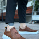 Brown casual sneakers with light blue sole and suede-like upper, side view