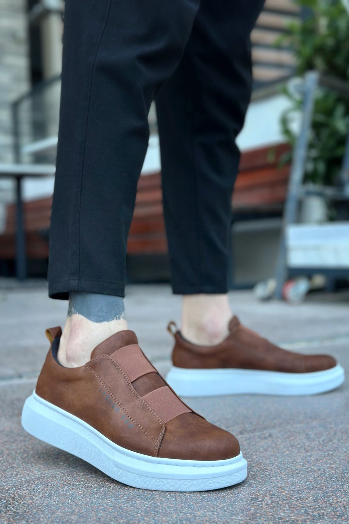 Brown casual sneakers with light blue sole and suede-like upper, side view