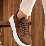 Men's brown suede sneakers with black laces and white rubber sole, side view