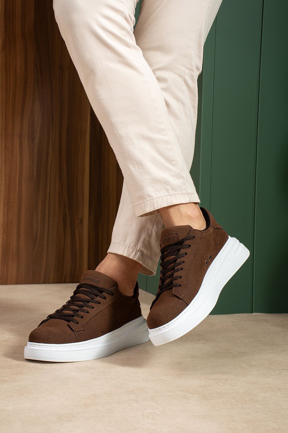 Men's brown suede sneakers with white midsole, low-top lace-up detail