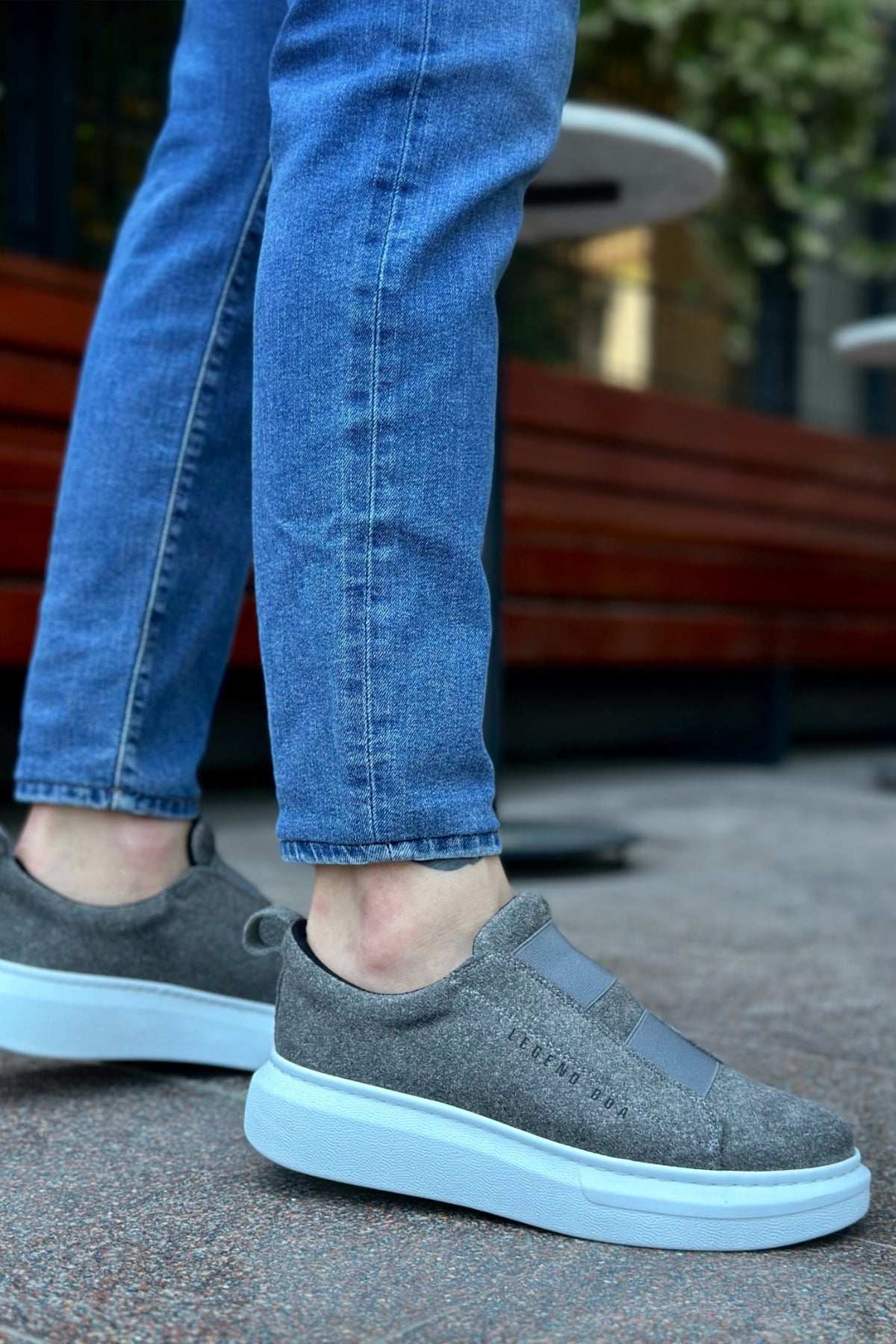 Gray suede sneakers with cushioned low sole and textured upper