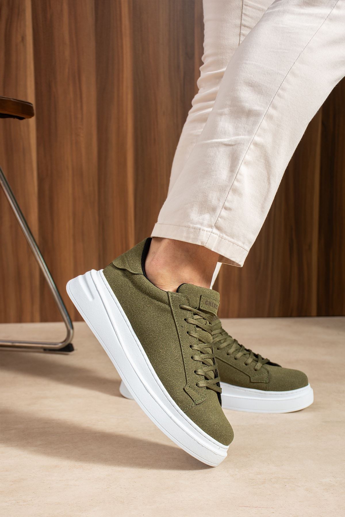 Men's olive suede low-top sneakers, lace-up with white rubber sole, side view
