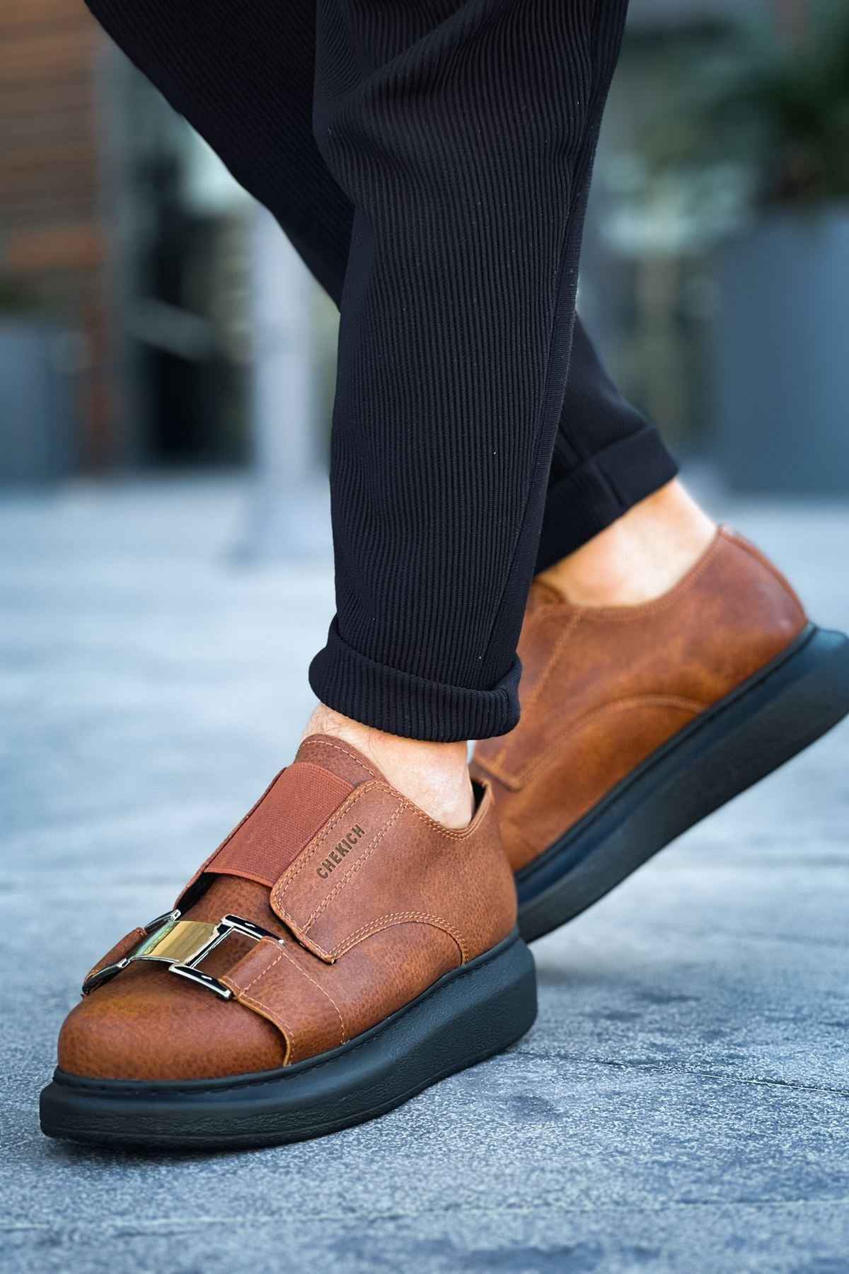 Men’s casual tan sneakers with double buckle straps and black rubber sole