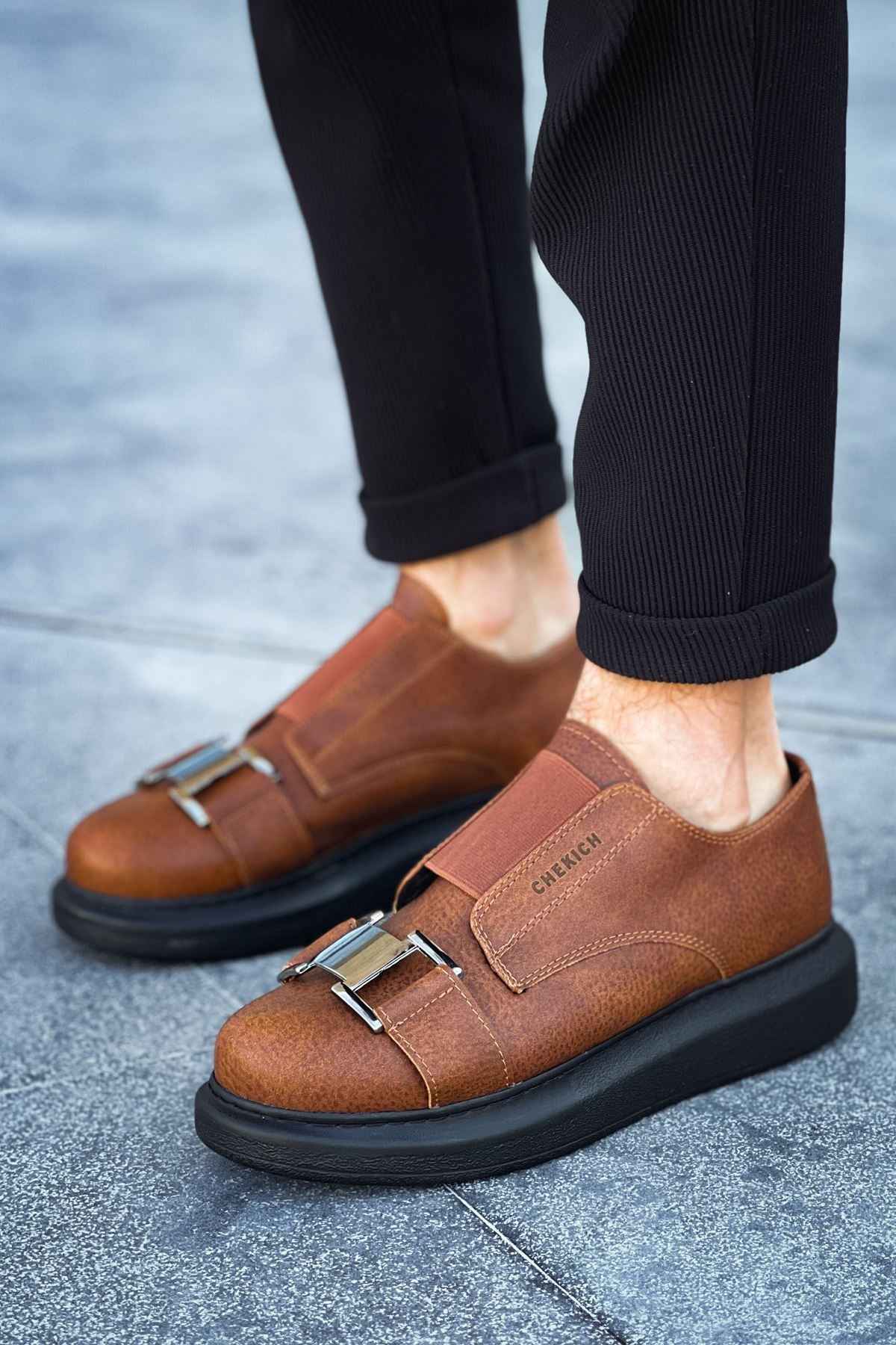 Men’s casual tan sneakers, side view with double buckle straps and black rubber sole