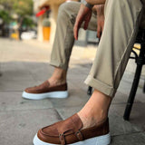 Men's tan casual loafers with buckle strap and white rubber sole