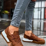 Men's tan casual sneakers with lace-up front and white rubber sole, side view