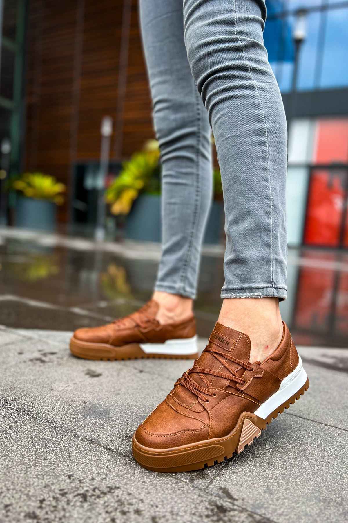 Men's tan casual sneakers with lace-up design and white sole, front angle