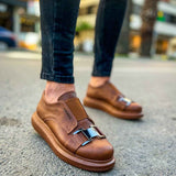 Tan casual sneakers with buckled straps and low-profile rubber sole