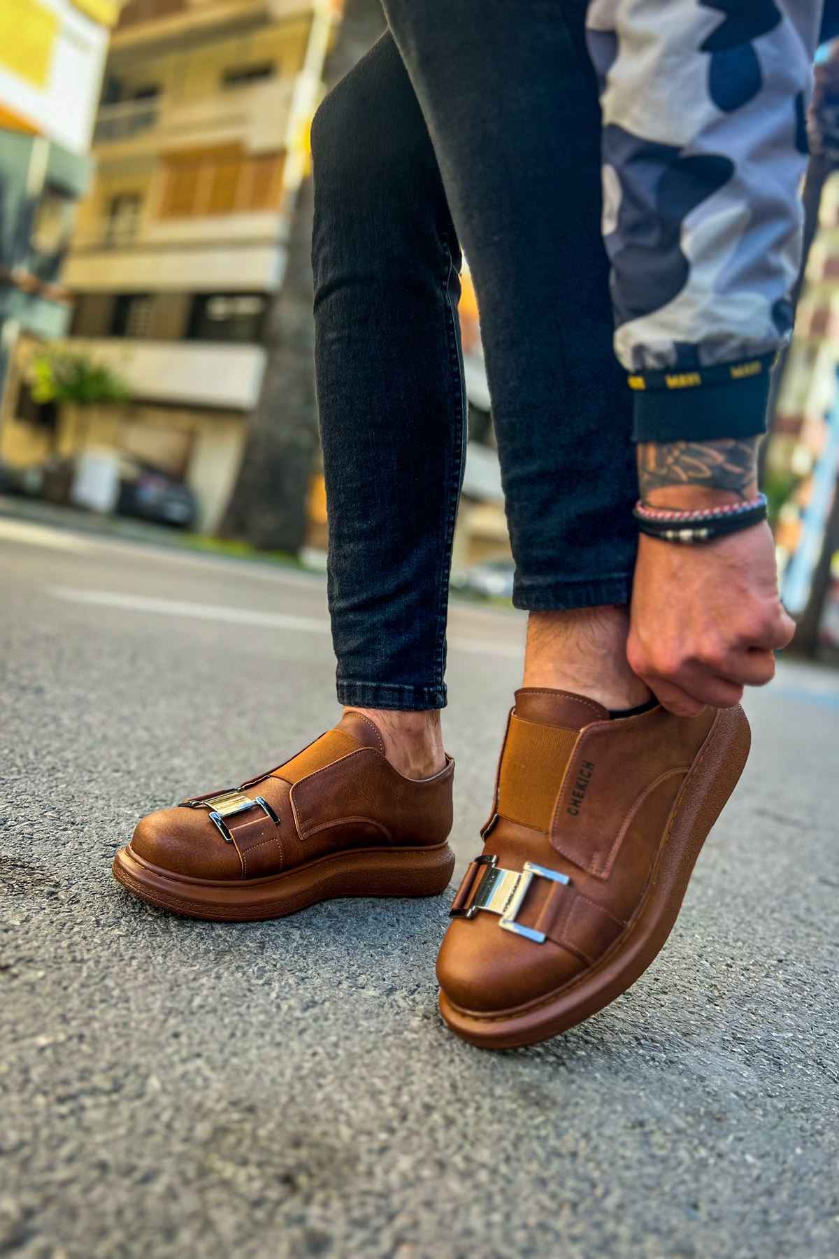 Tan casual sneakers, front view, dual buckle straps and cushioned collar