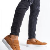 Men's tan suede slip-on loafers with white rubber sole